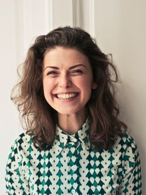 Woman studying for TOEFL, IELTS, and OET